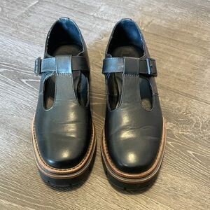 Korks Chunky Black Faux Leather T-Strap Mary Janes with Buckle